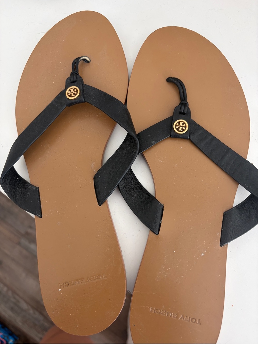 Tory Burch Black Leather Thong Sandals with Tan Soles and Gold Logos